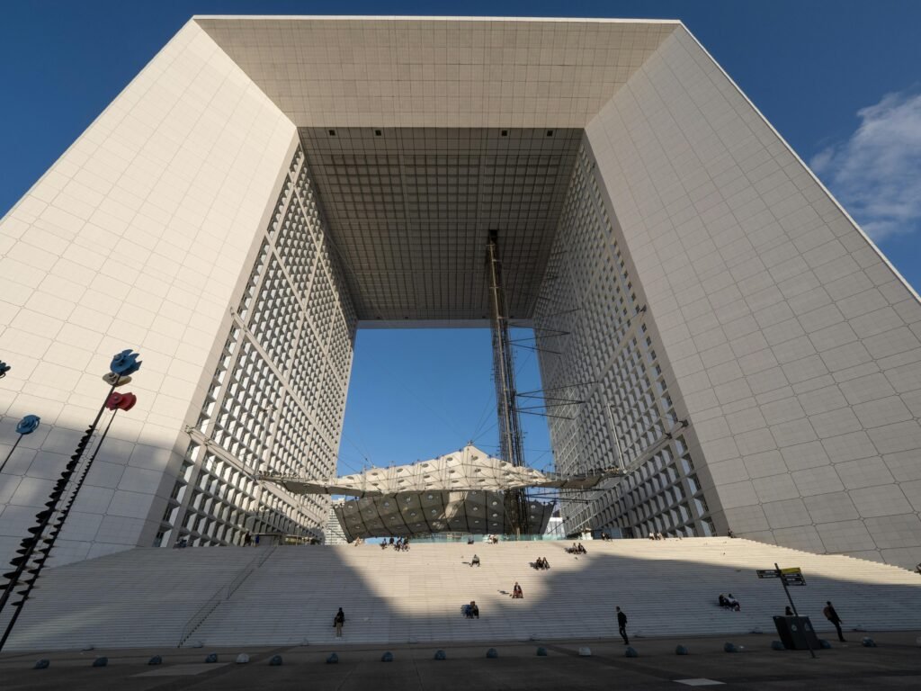 Modern architectural wonder La Grande Arche in sunny Paris, featuring sleek lines and open space.